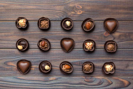 Different kinds of chocolates on colored table close-up. Top View and Flat Lay.の写真素材