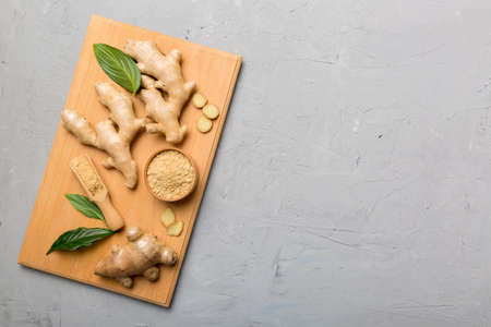 ginger on cutting board table, top view. Space for text.