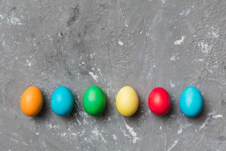 holiday preparation Multi colors Easter eggs on colored background . Pastel color Easter eggs....