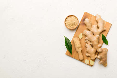 ginger on cutting board table, top view. Space for text.の写真素材