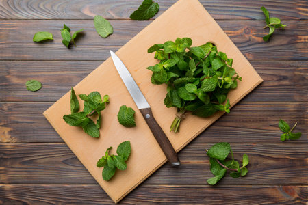 Fresh mint on Cutting board table, top view. Flat lay Space for text.の写真素材