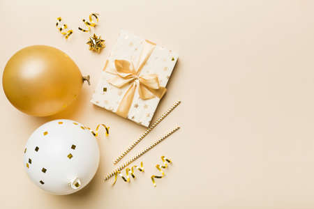 Holiday background with colorful balloon, gift and confetti. Flat lay style. Birthday or party greeting card with copy space.の写真素材