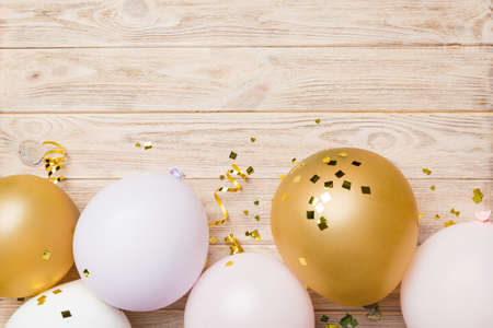 Background with fastive air balloons of round shape and confetti, multicolored top view. birthday party background.の写真素材