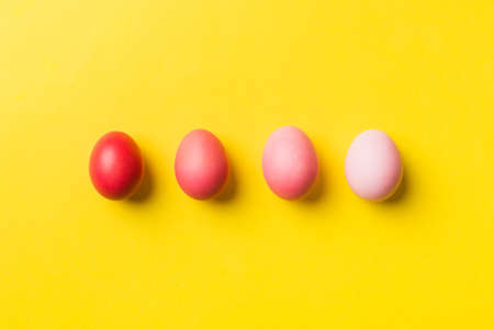 holiday preparation Multi colors Easter eggs on colored background . Pastel color Easter eggs....