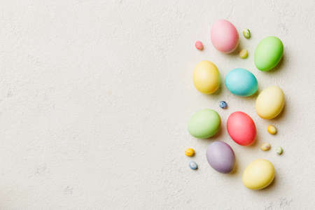holiday preparation Multi colors Easter eggs on colored background . Pastel color Easter eggs....
