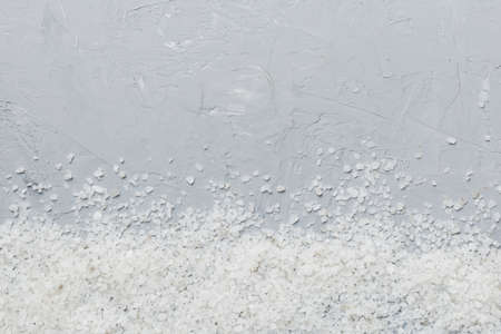 Background from white sea salt. Coarse rock salt texture witth copy space.