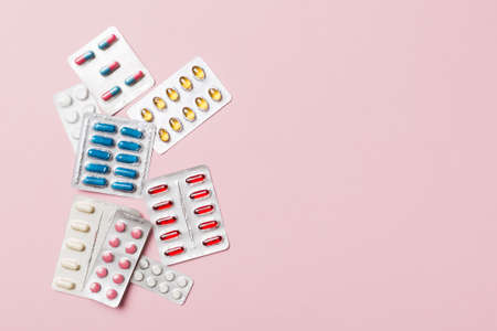 Protective face masks or surgical masks, medicine pills and thermometer on table background....