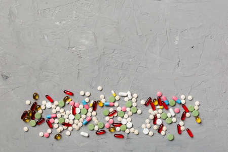 Protective face masks or surgical masks, medicine pills and thermometer on table background.