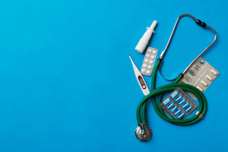 medical background. Many different various medicine tablets or pills on the table with stethoscope. close up. Health care pharmacy and medicine concept.の写真素材