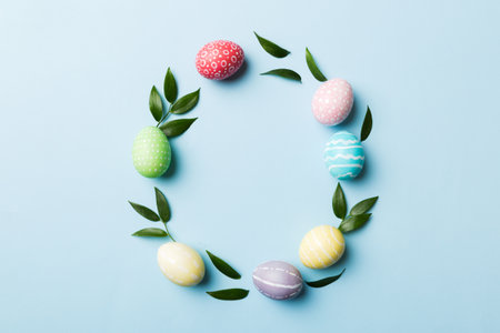 round frame Multi colors Easter eggs on colored background . Pastel color Easter eggs holiday...