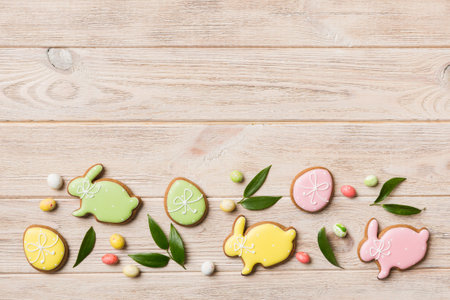 holiday preparation Multi colors Easter eggs with cookies on colored background . Pastel color Easter eggs. holiday concept with copy space.の写真素材