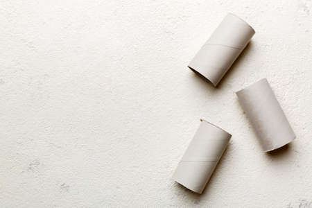 Flat lay composition with empty toilet paper rolls and space for text on color background....