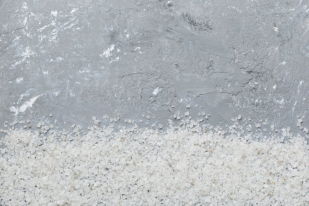 Background from white sea salt. Coarse rock salt texture witth copy space.