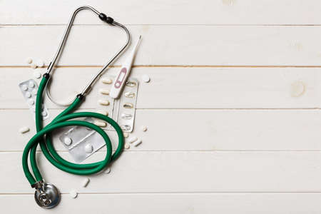 medical background. Many different various medicine tablets or pills on the table with stethoscope. close up. Health care pharmacy and medicine concept.の写真素材