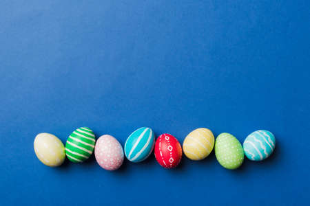 holiday preparation Multi colors Easter eggs on colored background . Pastel color Easter eggs....