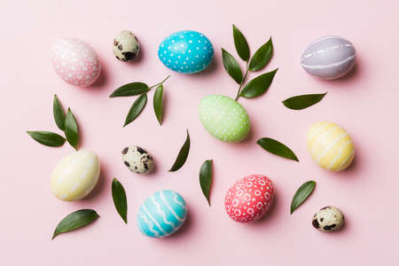 Colorful Easter eggs with spring flower leaf isolated over white background. Colored Egg Holiday...