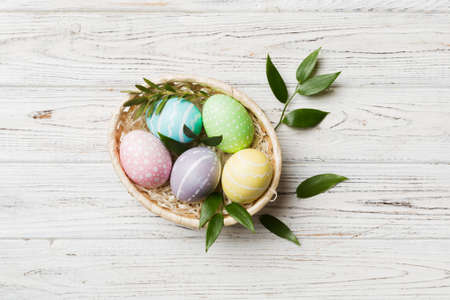 Colorful Easter eggs with spring flower leaf isolated over white background. Colored Egg Holiday...