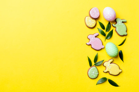 holiday preparation Multi colors Easter eggs with cookies on colored background . Pastel color Easter eggs. holiday concept with copy space.の写真素材
