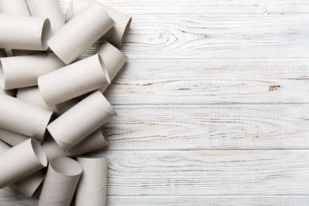 Flat lay composition with empty toilet paper rolls and space for text on color background. Recyclable paper tube with metal plug end made of kraft paper or cardboard.の写真素材