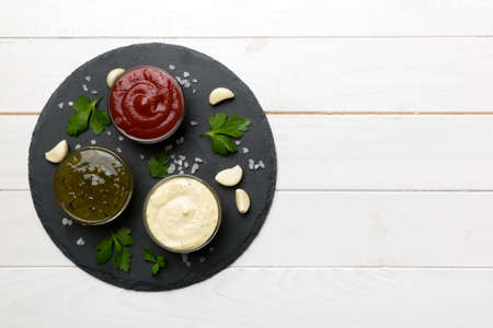 Many different sauces and herbs on table, flat lay top view. sauces on plate, healthy concept.の写真素材