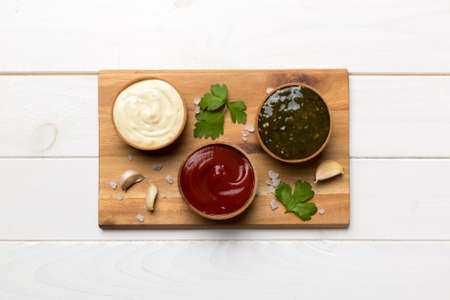 Many different sauces and herbs on table, flat lay top view. sauces on plate, healthy concept.の写真素材
