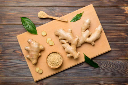 ginger on cutting board table, top view. Space for text.の写真素材