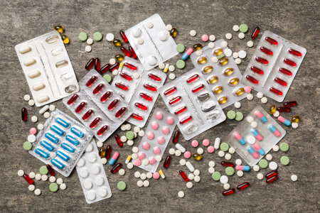 Protective face masks or surgical masks, medicine pills and thermometer on table background....