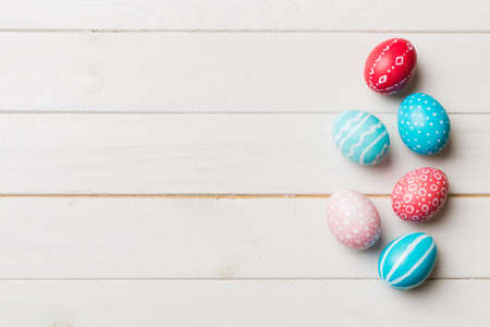 holiday preparation Multi colors Easter eggs on colored background . Pastel color Easter eggs....