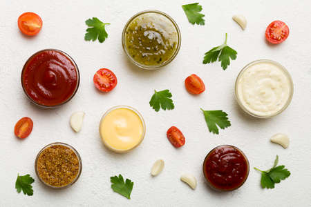 Many different sauces and herbs on table, flat lay top view. sauces with spices healthy concept.の写真素材