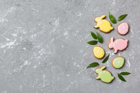 holiday preparation Multi colors Easter eggs with cookies on colored background . Pastel color Easter eggs. holiday concept with copy space.の写真素材