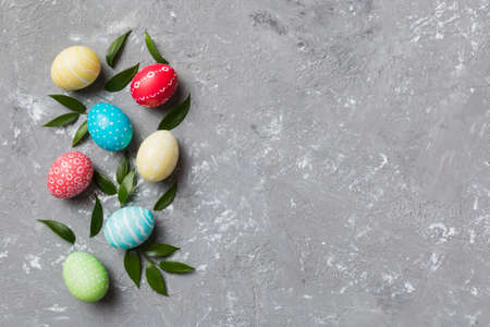 Colorful Easter eggs with spring flower leaf isolated over white background. Colored Egg Holiday...