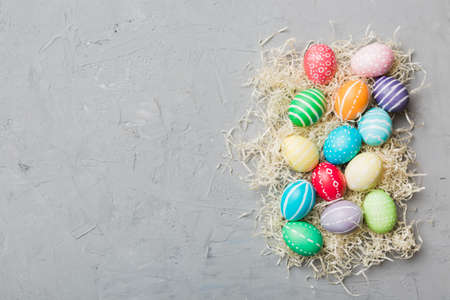 holiday preparation Multi colors Easter eggs on colored background . Pastel color Easter eggs....