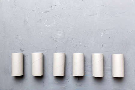 Flat lay composition with empty toilet paper rolls and space for text on color background....