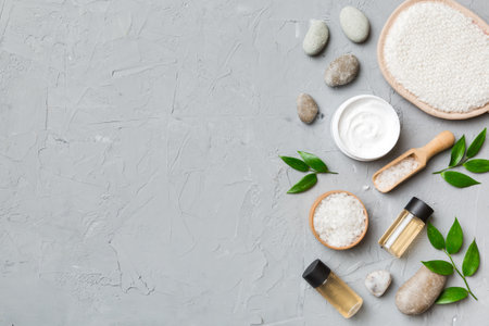 Coconut with jars of coconut oil and cosmetic cream on colored background. top view. Free space for your text. Natural spa coconut cosmetics and organic treatment concept Coconut Spa composition.の写真素材