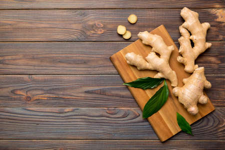 ginger on cutting board table, top view. Space for text.の写真素材