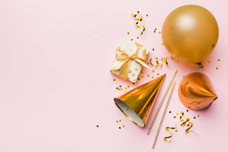 Holiday background with colorful balloon, gift and confetti. Flat lay style. Birthday or party...