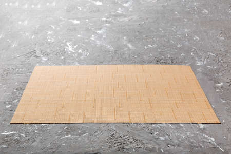 Perspective view of brown tablecloth for food on cement background. Empty space for your design.の写真素材