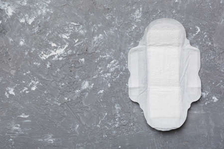 Women hygiene products or sanitary pad on colored background. pastel color. closeup. Empty place for text. Female daily hygiene.の写真素材