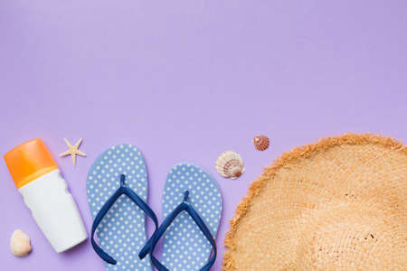 Summer vacation concept flat lay. straw hat beach accessories and towel top view. Space for text....