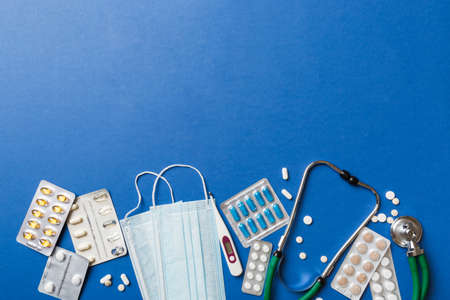 medical background. Many different various medicine tablets or pills on the table with stethoscope. close up. Health care pharmacy and medicine concept.の写真素材