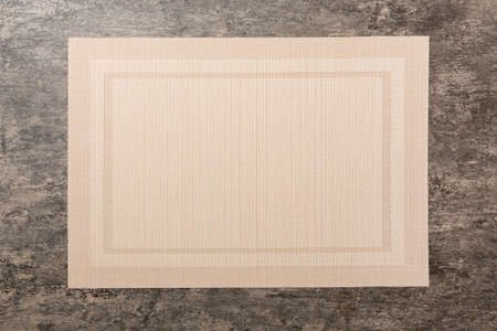 Top view of brown tablecloth for food on cement background. Empty space for your design.の写真素材