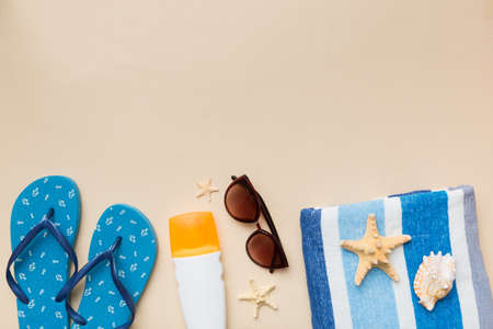 Summer vacation concept flat lay. beach accessories and towel top view. Space for text. travel...