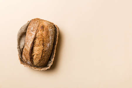 Freshly baked bread on basket against natural background. top view bread copy space.
