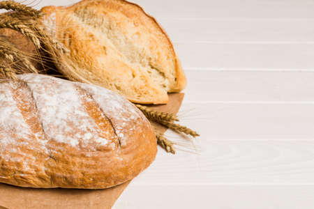 Homemade natural breads. Different kinds of fresh bread as background, perspective view with copy...