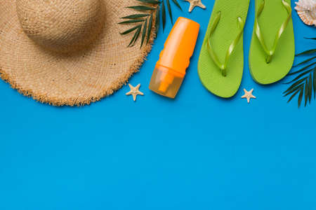 Summer vacation concept flat lay. straw hat beach accessories and towel top view. Space for text. travel concept.の写真素材
