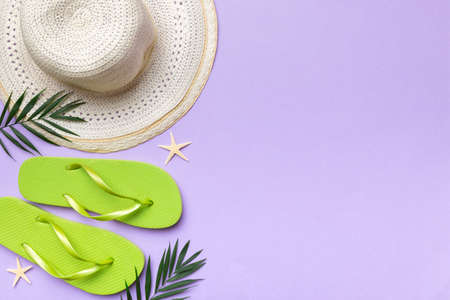 Summer vacation concept flat lay. straw hat beach accessories and towel top view. Space for text....