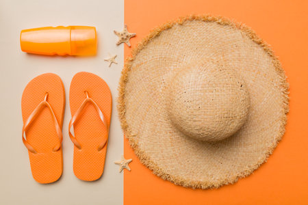 Summer vacation concept flat lay. straw hat beach accessories and towel top view. Space for text. travel concept.の写真素材