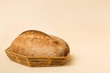 Freshly baked bread on basket against natural background. Perspective view bread copy space.の写真素材