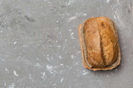 Freshly baked bread on basket against natural background. top view bread copy space.の写真素材