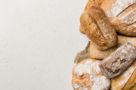 Homemade natural breads. Different kinds of fresh bread as background, top view with copy space.の写真素材